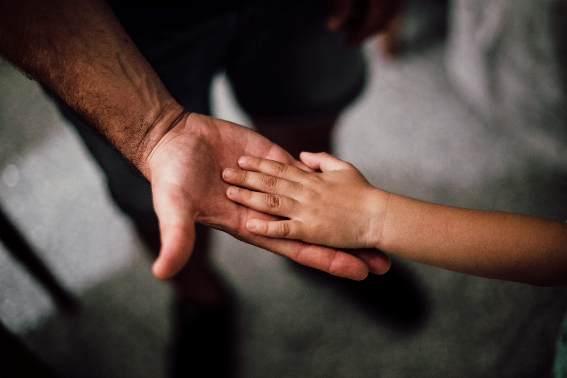 selective-focus-photography-of-child-hand-1250452