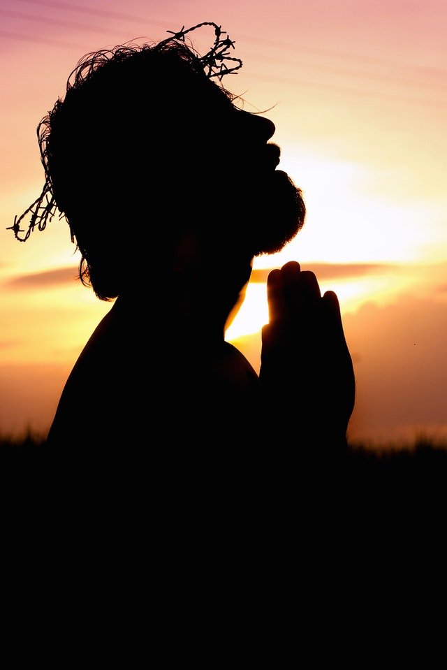 silhouette-image-of-person-praying-1615776