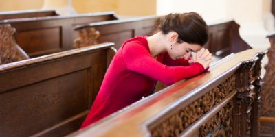 web3-young-woman-praying-in-a-church0a-shutterstock_119769976e28086